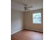 Cozy bedroom with neutral walls, ceiling fan and large window bringing in natural light at 604 Pepperwood Ln, Stone Mountain, GA 30087