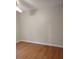 Bedroom features hardwood floors, ceiling fan, and entry to another room at 604 Pepperwood Ln, Stone Mountain, GA 30087