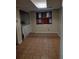 Practical laundry room with tile flooring and space for washer and dryer at 604 Pepperwood Ln, Stone Mountain, GA 30087