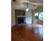 Spacious living room featuring a stone fireplace, vaulted ceiling, and hardwood floors at 604 Pepperwood Ln, Stone Mountain, GA 30087