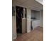 Utility room featuring a furnace and adjacent laundry room with washer and dryer hookups at 604 Pepperwood Ln, Stone Mountain, GA 30087