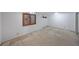 Large basement area with carpet flooring and a window for natural light at 629 Birchwood Rd, Marietta, GA 30060