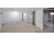 Basement with mirrored closets, white walls and access to the lower level utilities at 629 Birchwood Rd, Marietta, GA 30060