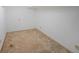 Unfinished basement with white walls and carpeting, showing plenty of room for storage or renovation at 629 Birchwood Rd, Marietta, GA 30060