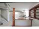 Basement with bar, stairs, shelving and cabinetry, offering great potential for entertaining at 629 Birchwood Rd, Marietta, GA 30060
