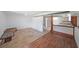 Spacious basement with a combination of hardwood flooring and carpet, leading to stairs and an open doorway at 629 Birchwood Rd, Marietta, GA 30060
