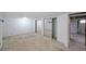 Basement featuring sliding door closets and exposed ductwork, showing functional space and access points at 629 Birchwood Rd, Marietta, GA 30060