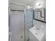 Bathroom with a glass door shower, a vanity, and tiled walls at 629 Birchwood Rd, Marietta, GA 30060