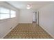 Bedroom with white walls and patterned flooring is bright and airy at 629 Birchwood Rd, Marietta, GA 30060