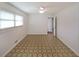 A bedroom with a window for natural light, a ceiling fan, and white paneled walls at 629 Birchwood Rd, Marietta, GA 30060