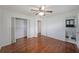 Spacious bedroom with hardwood floors and a walk-in closet, with a view of the bathroom at 629 Birchwood Rd, Marietta, GA 30060