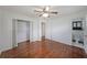 Bedroom with hardwood flooring, ceiling fan and ensuite bathroom and closet at 629 Birchwood Rd, Marietta, GA 30060