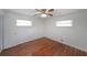 Bedroom with hardwood flooring, two windows and white trim at 629 Birchwood Rd, Marietta, GA 30060