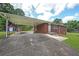 Covered carport providing ample parking space and access to the brick home at 629 Birchwood Rd, Marietta, GA 30060