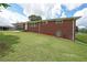 Charming brick home with a well-maintained lawn and easy access to the carport at 629 Birchwood Rd, Marietta, GA 30060