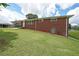 Brick house featuring a well-maintained lawn and a convenient side entrance at 629 Birchwood Rd, Marietta, GA 30060