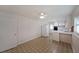 Eat-in kitchen with bright white cabinets, and a vintage-inspired aesthetic at 629 Birchwood Rd, Marietta, GA 30060