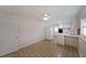 Spacious eat-in kitchen with white cabinets, appliances, and decorative flooring at 629 Birchwood Rd, Marietta, GA 30060