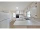 Well-lit kitchen featuring white cabinets, classic appliances, and a convenient counter space at 629 Birchwood Rd, Marietta, GA 30060