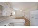 Eat-in kitchen features white cabinetry, appliances, and decorative flooring at 629 Birchwood Rd, Marietta, GA 30060