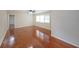 Light-filled living room with polished hardwood floors and neutral wall paint at 629 Birchwood Rd, Marietta, GA 30060