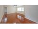 Inviting living room featuring shiny hardwood floors and neutral walls at 629 Birchwood Rd, Marietta, GA 30060
