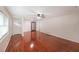 Living room with hardwood floors, natural light, and a classic display cabinet at 629 Birchwood Rd, Marietta, GA 30060