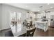Bright and modern kitchen featuring a dining table, stainless steel appliances, and an island at 631 Avondale Creek Dr, Decatur, GA 30032