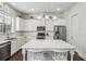 Modern kitchen featuring stainless steel appliances, subway tile backsplash, and an island at 631 Avondale Creek Dr, Decatur, GA 30032