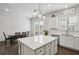 Eat-in kitchen featuring a large island, modern lighting, and ample countertop space at 631 Avondale Creek Dr, Decatur, GA 30032