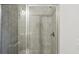 A standup shower with glass doors and tile surround at 631 Avondale Creek Dr, Decatur, GA 30032