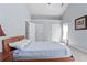 Relaxing bedroom features natural light and fresh carpet at 174 Saint Georges Ct, Suwanee, GA 30024