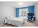 Cozy bedroom with a ceiling fan, carpet floors, and a bright window at 174 Saint Georges Ct, Suwanee, GA 30024