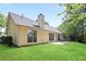 Exterior back of home with a patio perfect for outdoor relaxation at 174 Saint Georges Ct, Suwanee, GA 30024