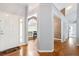 Foyer with hardwood floors leading to the dining room and living areas at 174 Saint Georges Ct, Suwanee, GA 30024