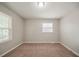 Bedroom featuring tan walls, brown carpet, and natural light at 3731 Adkins Nw Rd, Atlanta, GA 30331