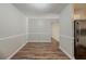 A dining room with hardwood floors, base trim, and light gray paint at 3731 Adkins Nw Rd, Atlanta, GA 30331