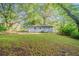 The home is nestled into a large lot with beautiful mature trees at 3731 Adkins Nw Rd, Atlanta, GA 30331