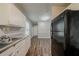 Kitchen featuring updated appliances, cabinets, and plank flooring for modern appeal at 3731 Adkins Nw Rd, Atlanta, GA 30331