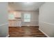 Well-lit kitchen area with sleek countertops, modern appliances, and durable wood flooring at 3731 Adkins Nw Rd, Atlanta, GA 30331