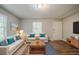 Inviting living room with hardwood floors, ample natural light, and stylish contemporary furnishings at 3731 Adkins Nw Rd, Atlanta, GA 30331