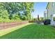 Large fenced yard with luscious grass and backyard patio set at 4230 Old Cherokee St, Acworth, GA 30101