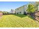 Large, fenced backyard featuring a well-manicured lawn, home, and patio at 4230 Old Cherokee St, Acworth, GA 30101