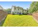 Large, fenced backyard featuring a well-manicured lawn and patio at 4230 Old Cherokee St, Acworth, GA 30101
