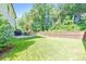 Spacious backyard features a well maintained lawn, privacy fence, and outdoor dining set at 4230 Old Cherokee St, Acworth, GA 30101