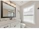 A clean bathroom with a white vanity, a modern mirror, and ample lighting at 4230 Old Cherokee St, Acworth, GA 30101
