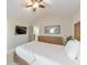 A comfy bedroom featuring a wooden bed frame, a ceiling fan, and neutral decor at 4230 Old Cherokee St, Acworth, GA 30101