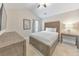 A comfortable bedroom with a wooden bed frame, soft lighting, and neutral decor at 4230 Old Cherokee St, Acworth, GA 30101