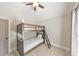 Charming bedroom with bunk beds, a ceiling fan, and a window for natural light at 4230 Old Cherokee St, Acworth, GA 30101