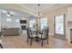 Bright dining area with hardwood floors and views of the cozy living room at 4230 Old Cherokee St, Acworth, GA 30101